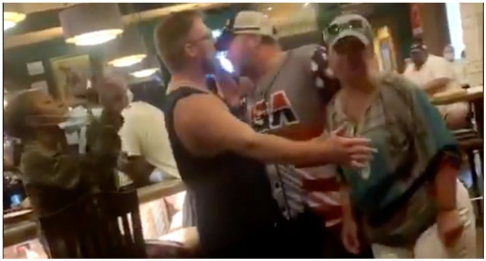 WATCH: Man gets hit over the head with a bottle during brawl over social distancing