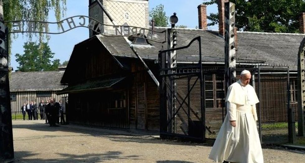 Pope Francis walks alone through horrors of Auschwitz