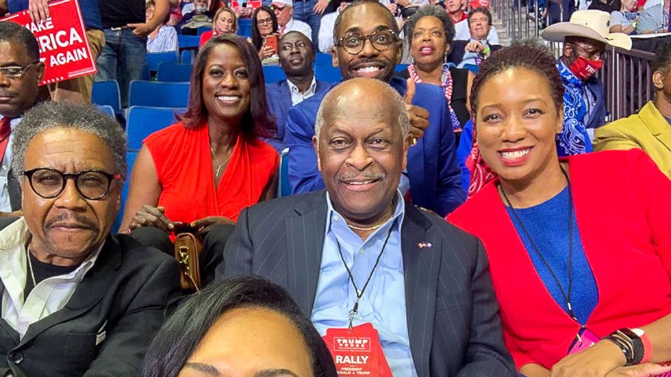 Herman Cain admitted to hospital with COVID-19 after going mask-free at Trump's Tulsa rally