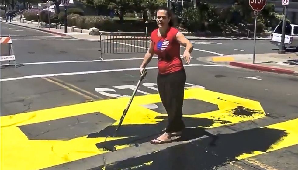 'There is no racism': Couple destroying Black Lives Matter mural faces off against bystanders