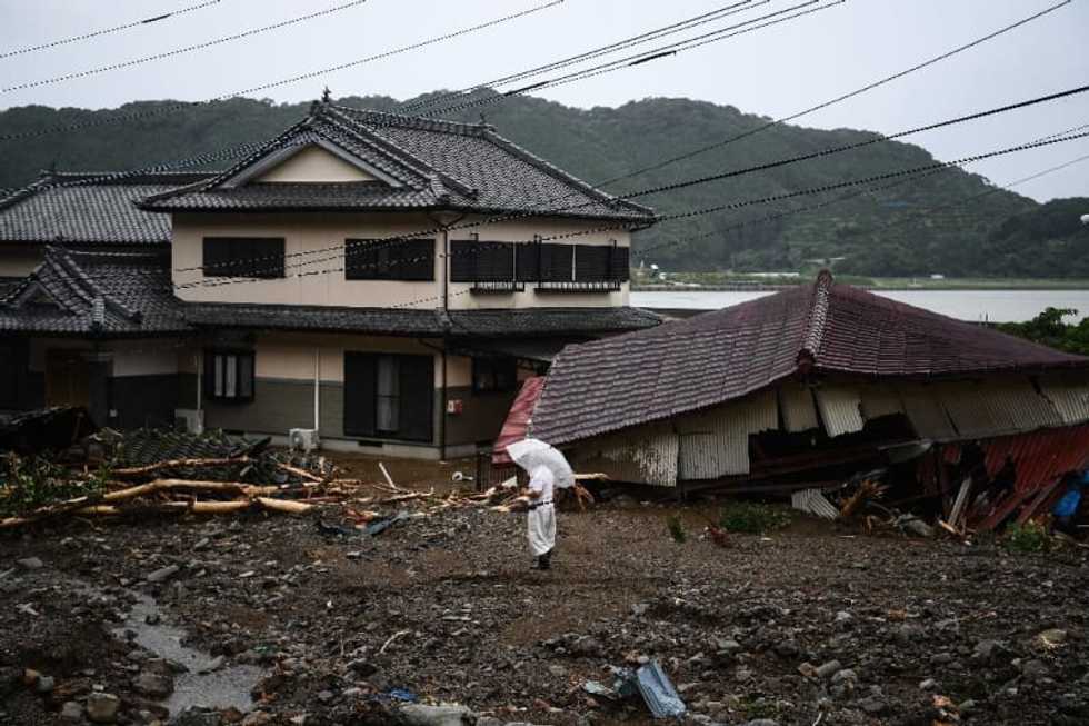 50 dead in Japan floods as rescuers 'race against time'