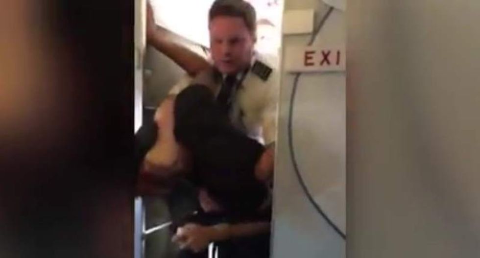 'Don’t put your hands on my flight attendant': Watch this pilot take down a drunk passenger