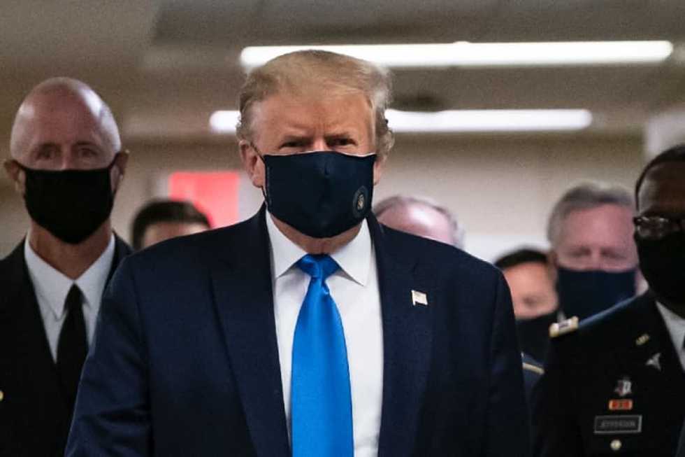 As virus rages in US, Trump finally wears a mask