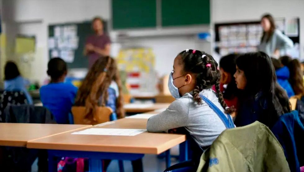 Teacher deaths and college-town outbreaks deepen concern over COVID-19 risks stirred by school reopenings