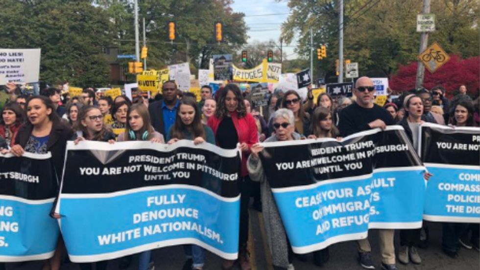 WATCH: Trump's motorcade forced to turn around after thousands of protesters flood Pittsburgh streets
