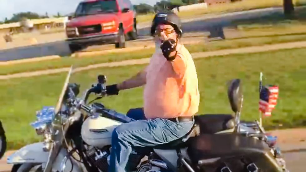 White biker caught on video raging at black basketball coach: 'Pay attention n****r'