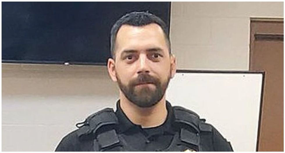 Cop threatened to shoot protesters if they came to his door -- now he's charged with killing a fellow officer who knocked