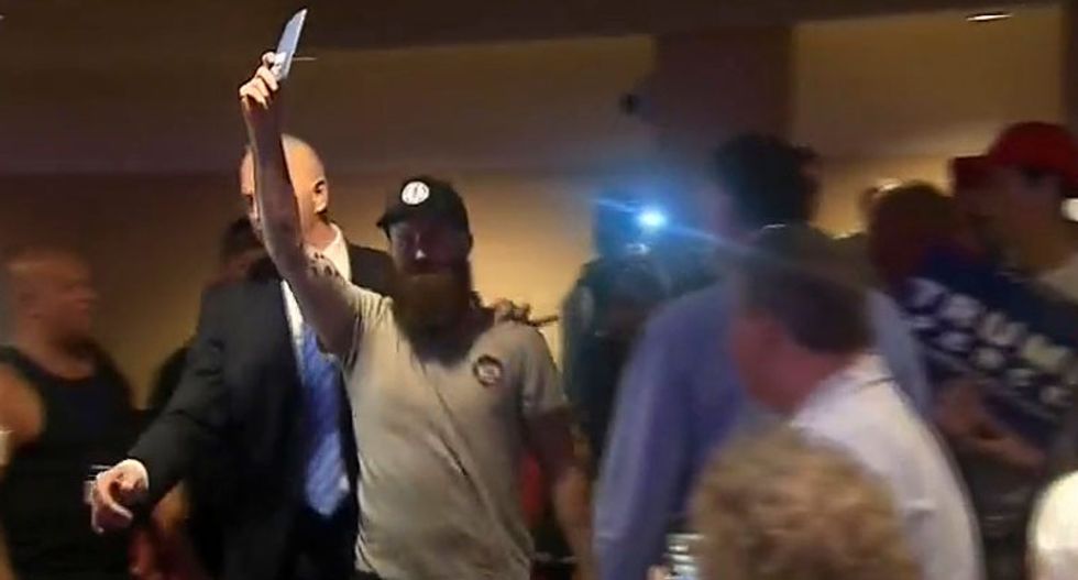 WATCH: Trump supporters viciously boo protesters for holding up copies of the Constitution at rally