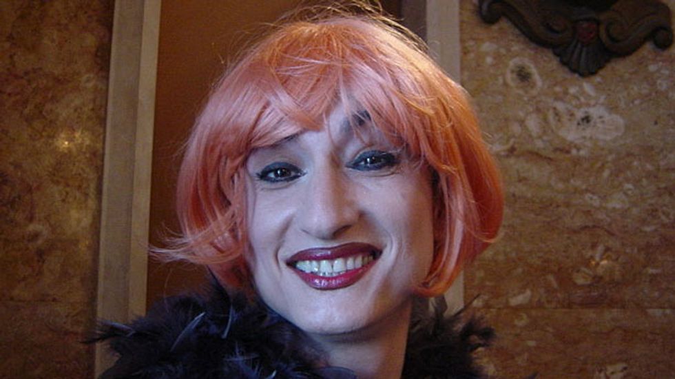 Europe's first openly transgender lawmaker arrested for holding 'Gay is OK' banner in Sochi