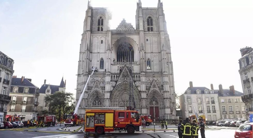Volunteer confesses to setting French cathedral on fire