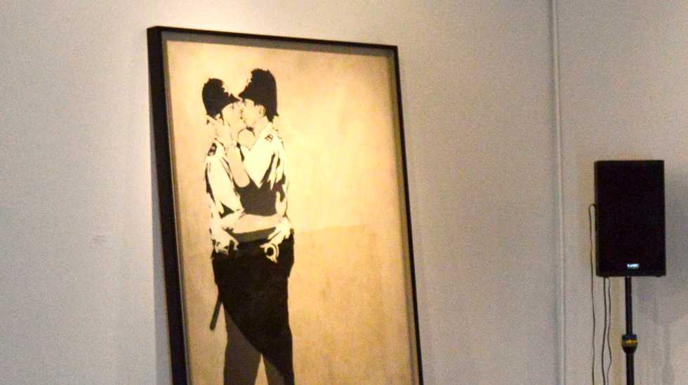 Banksy mural 'Kissing Coppers' auctioned for $575,000 in Miami