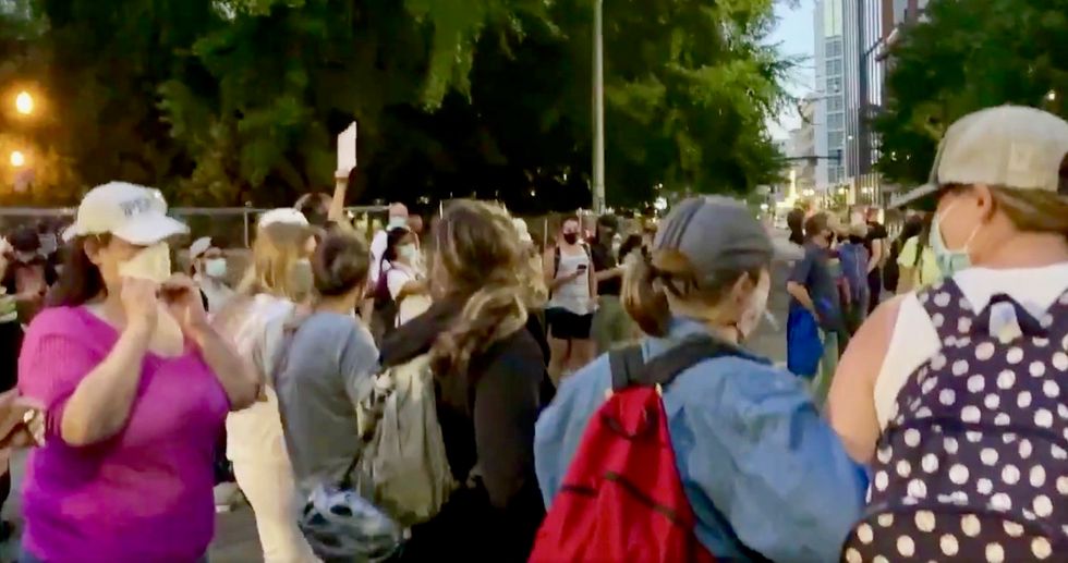 Trump’s paramilitary secret police are tear-gassing sunflower-wielding moms defending BLM protestors in Portland