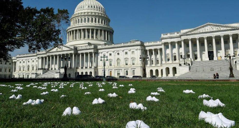 Nurses display 164 pairs of white shoes at the Capitol to symbolize their colleagues killed by COVID-19