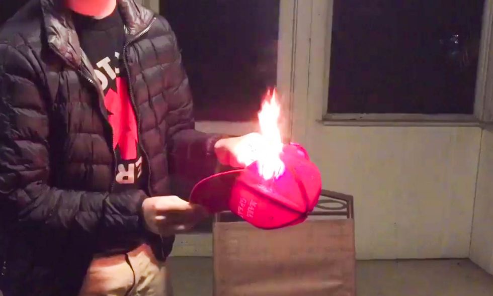 ‘You will never make America great again!‘: Watch angry Trump fans burn their MAGA hats over DACA deal