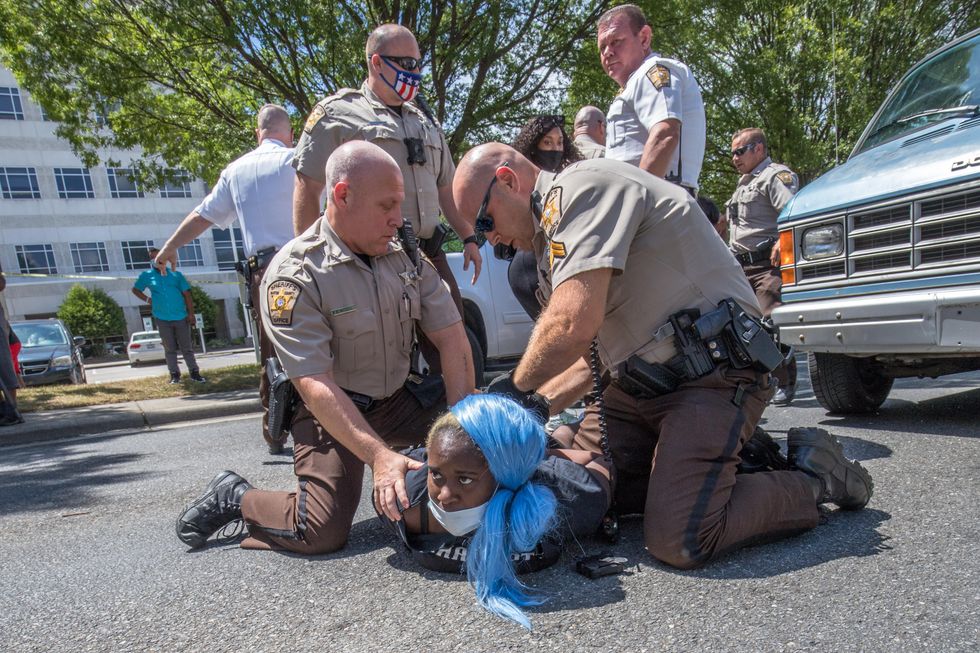 Chaos erupts in North Carolina town as violent counterprotesters clash with anti-racist activists