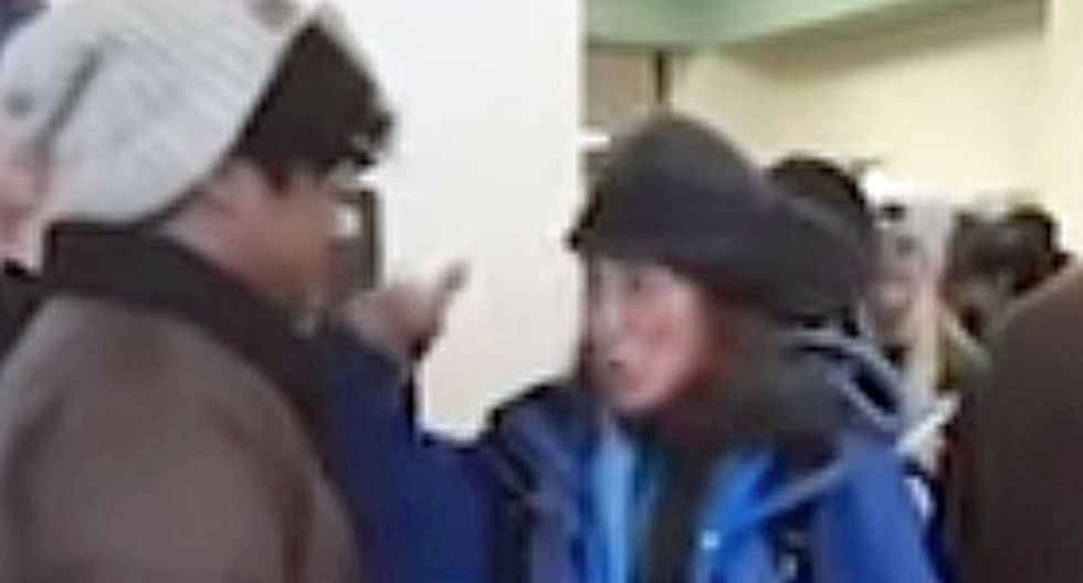 WATCH: White woman arrested for racist tirade against young man standing in line to vote