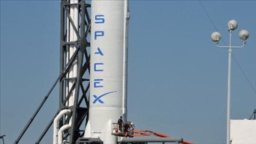 SpaceX readies rocket bearing climate satellite and will re-try ocean landing