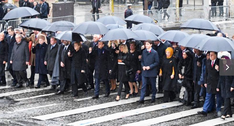 World leaders mark WWI centenary in sombre Paris ceremony as Trump arrives separately