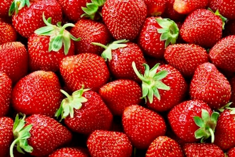 Australia charges woman with using needles to contaminate strawberries