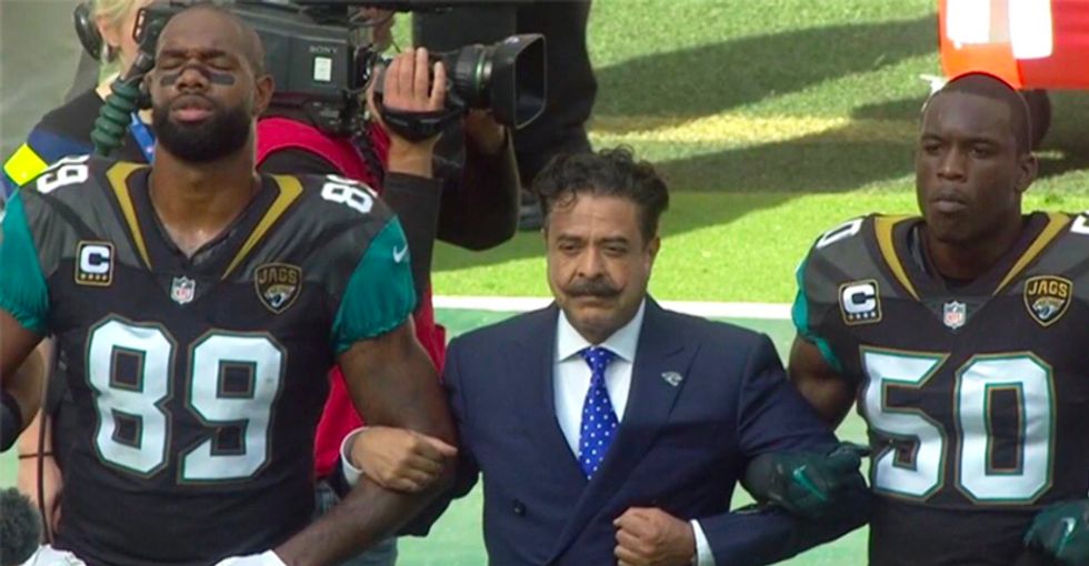 WATCH: NFL players, coaches and owner take knees and lock arms at London game in defiance of Trump