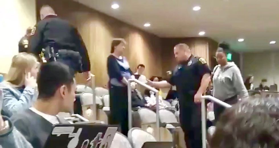 White professor calls cops on black university student for putting her feet on chair during class