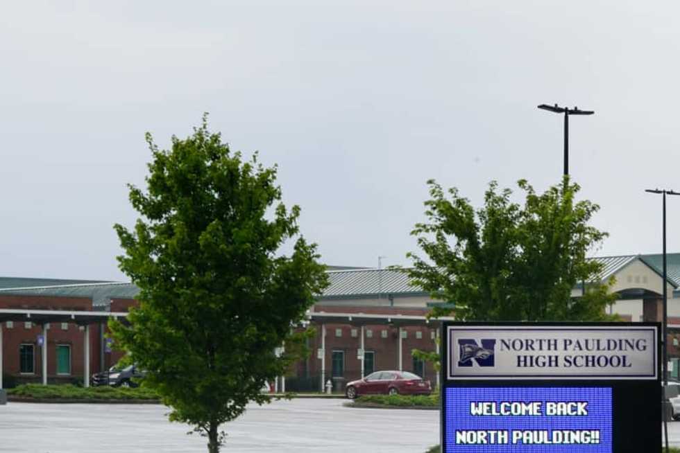 Georgia high school that drew national attention over masks will reopen part time