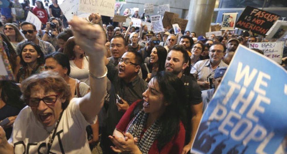 Washington judge blocks Trump immigration order with injunction