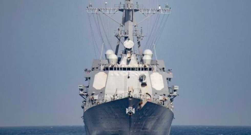 Iranian military ships charge with weapons out at US Navy destroyer