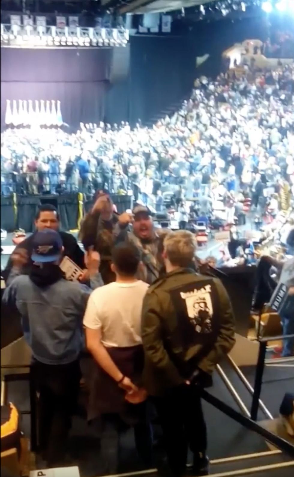WATCH: Enraged Trump supporter puts protester in a headlock and tries to drag him away