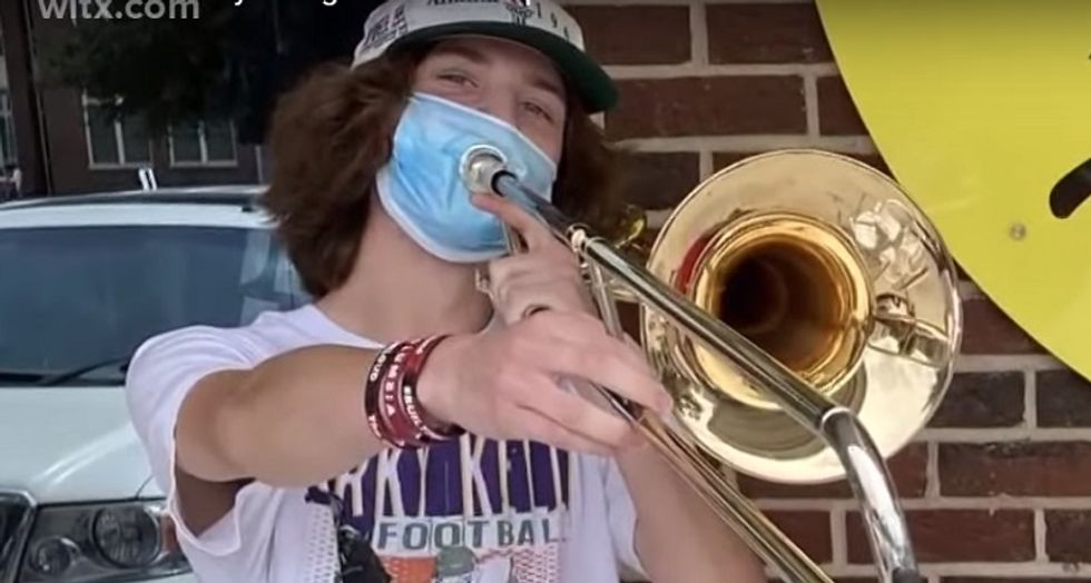 WATCH: Students cheer trombone player as he drowns out man's rants about 'thug' BLM demonstrators