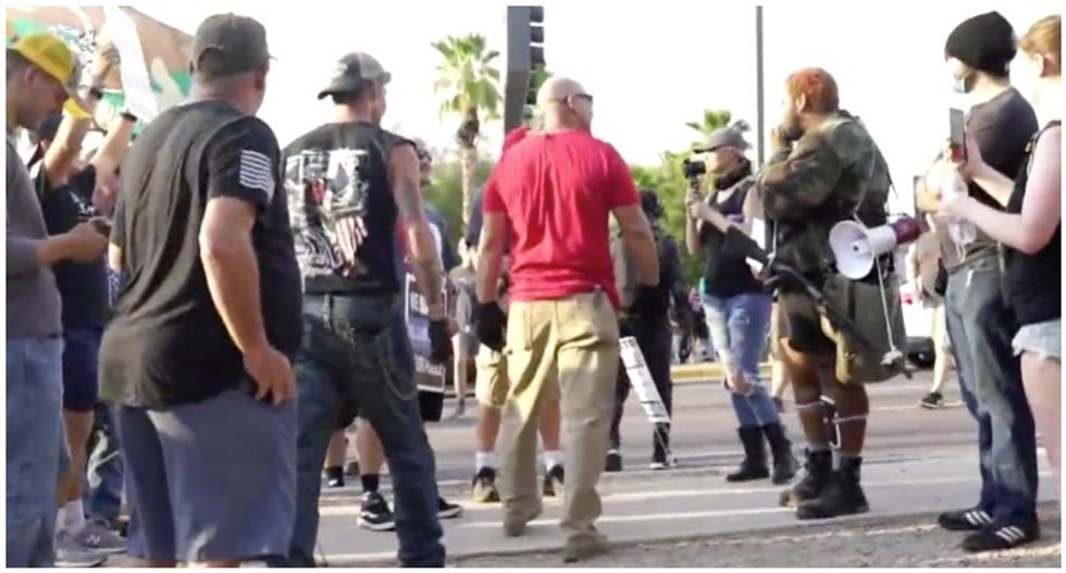 ‘Hunting season’: Violence erupts in Arizona as Nazi-saluting ‘blue line’ supporters confront protesters