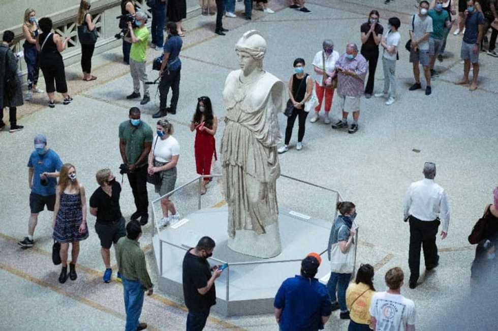 New Yorkers celebrate Met's reopening as a sign life is returning