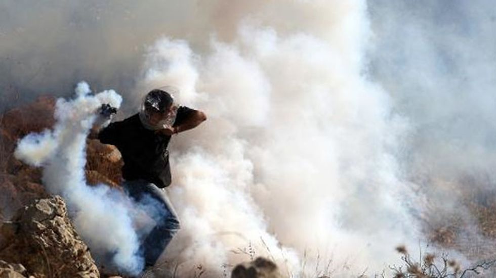 A father opens his plastic bag: 'This is my son,' he says, killed by Israeli shell