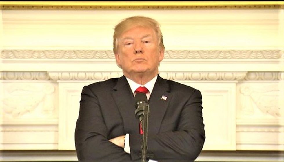 WATCH: Testy Trump folds his arms and pouts as Dem governor rips apart his plan to arm teachers