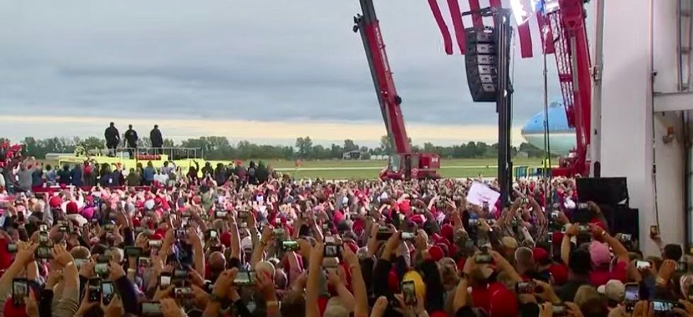 'It's a superspreader event': Few masks in sight at packed Trump campaign rally in Michigan