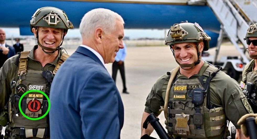 Mike Pence deletes photo of himself with QAnon conspiracy-loving cop after believers freak out