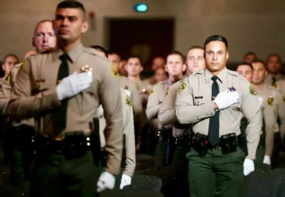 Gunman charged in 'cold-blooded' shooting of two Los Angeles police