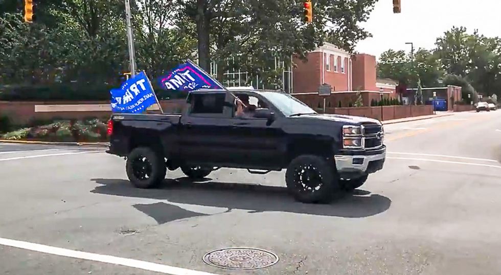 WATCH: Trump supporters yell 'white power' as 2020 convoy speeds through college town