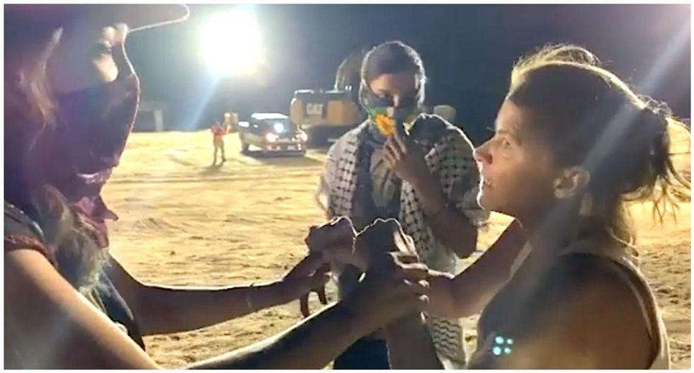 WATCH: Woman physically attacks Native Americans protesting Trump's border wall