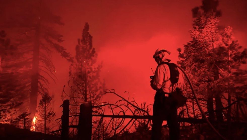 California firefighters race to tame wildfires before hot, windy weather returns