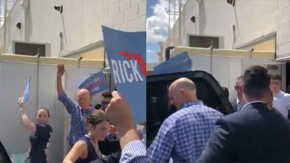 'You coward': Protesters force Republican Rick Scott out of a restaurant during a campaign stop