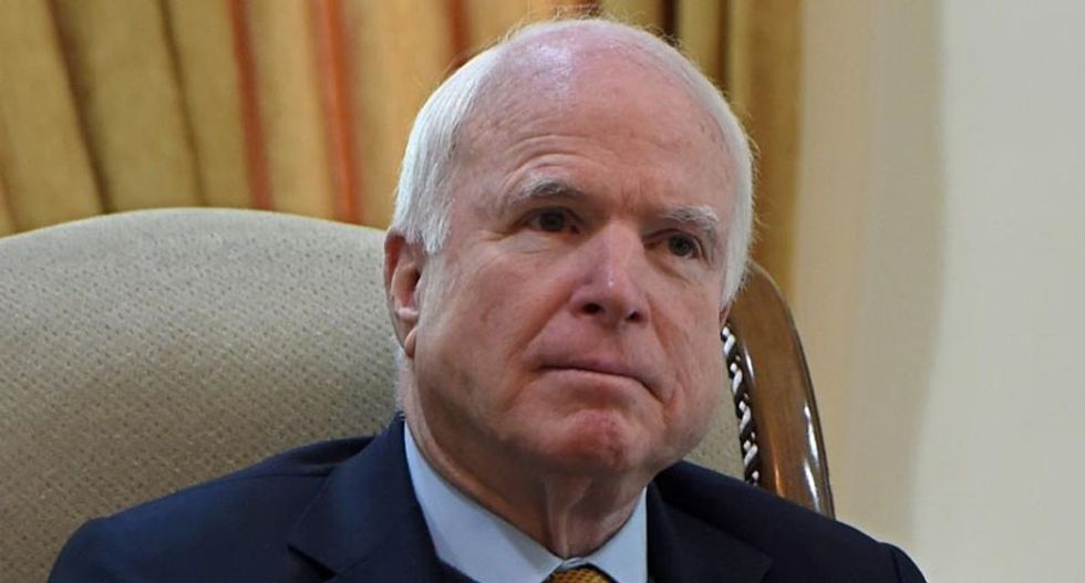 John McCain mocks Obama for calling climate change a threat as ISIS advances