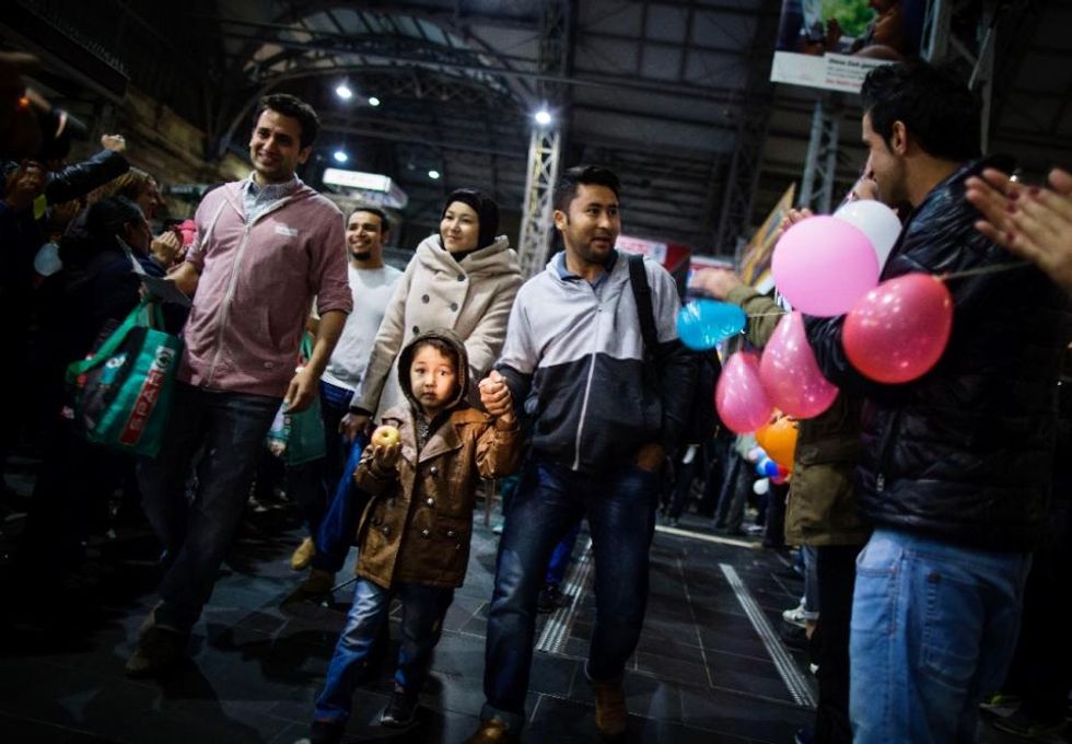 Bemused refugees get emotional welcome in Germany