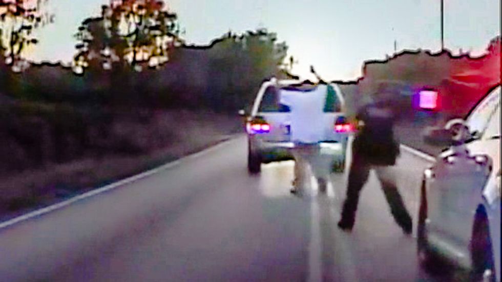 Dash cam video shows unarmed black man with hands in air before Tulsa police shoot him dead