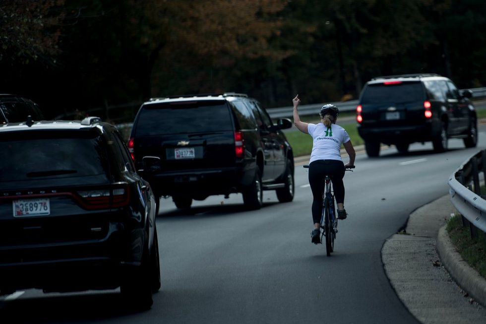 Virginia woman flips off Trump after chasing down motorcade on bike
