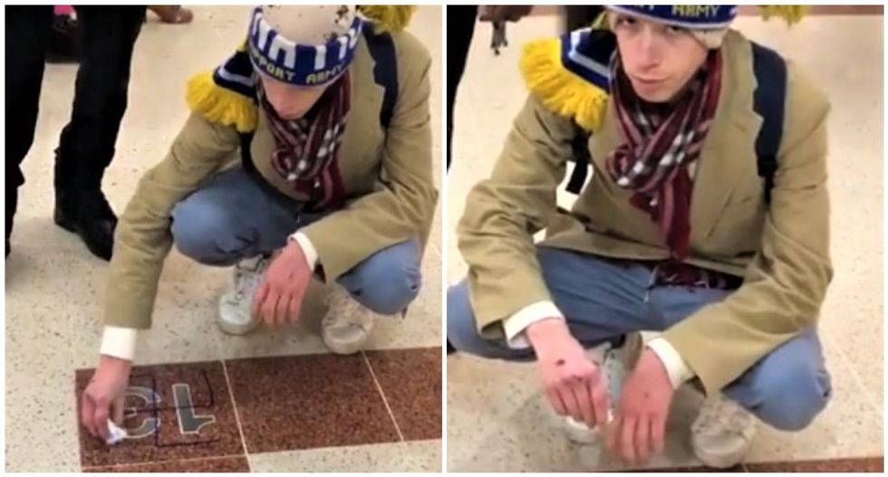 'Clean it, d*ckhead!' Teen who who drew swastika on building forced to scrub it while bystanders mock him
