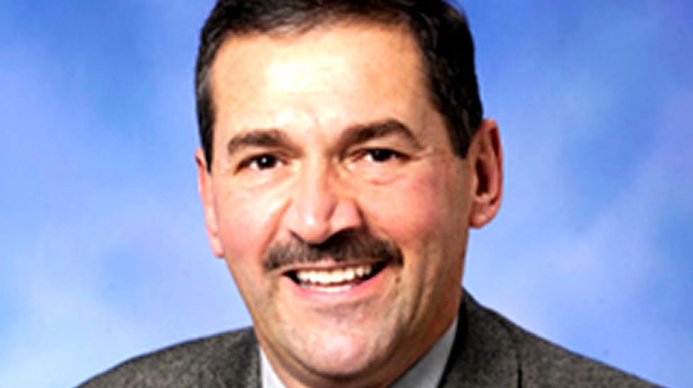 Michigan lawmakers pose with women's magazines to show they care. Guess which party.