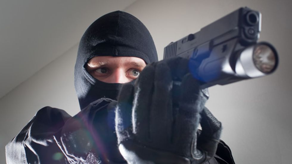 Innocent man instantly shot by police after gamer feud over $2 results in 'swatting' prank at Kansas home