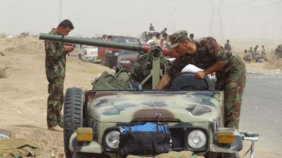 Iraqi Kurds take control of disputed areas as jihadists offensive continues
