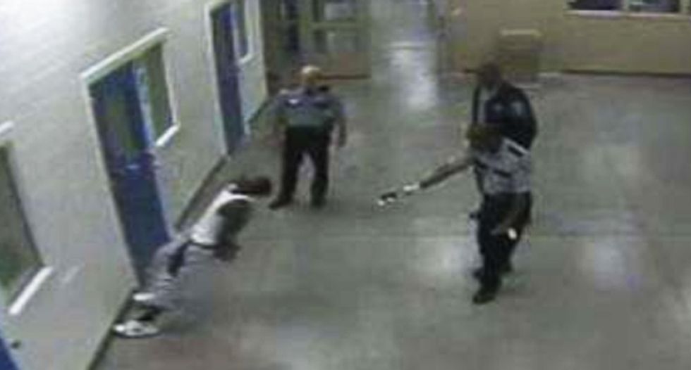 Jail house video busts Georgia cops Tasering compliant black man from behind